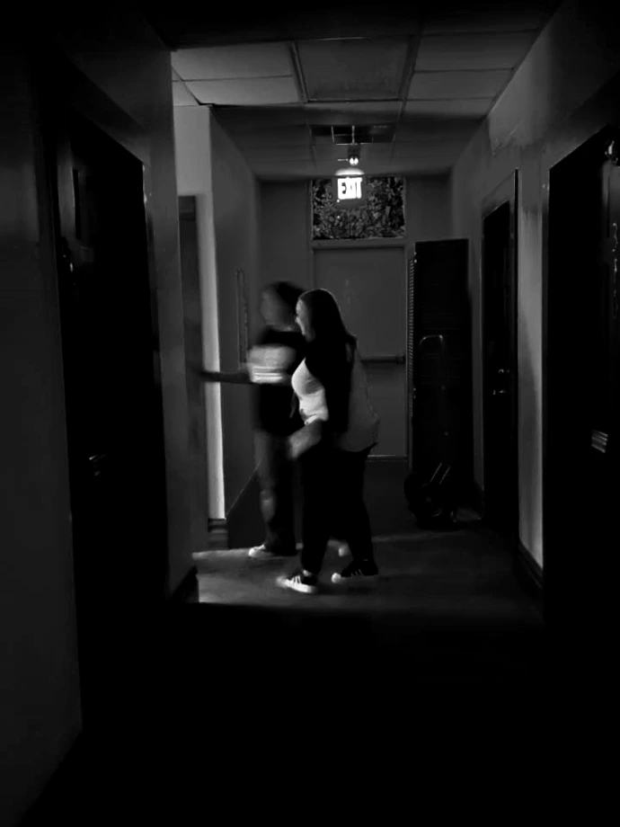 Eerie shadow silhouette in a dark hallway during a Terrell paranormal investigation